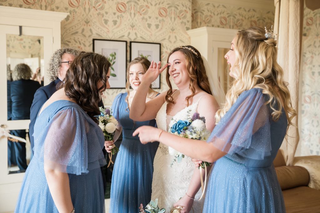 wedding photography at hodsock priory. Bridesmaids and bride candid photograph.