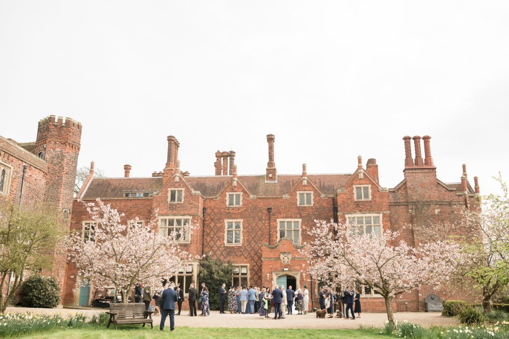 wedding photography at hodsock priory. The full bridal party outside very candid.